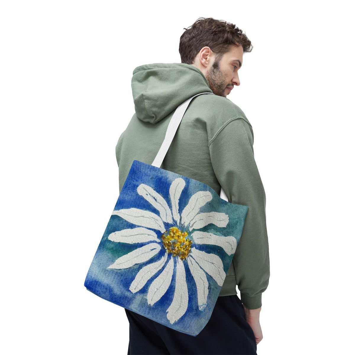 Watercolor daisy tote bag featuring a large hand-painted white daisy with a golden center on a deep blue and teal watercolor background, floral botanical shoulder bag designed from original artwork by Kathryn Young for Good For The Soul Art LLC.