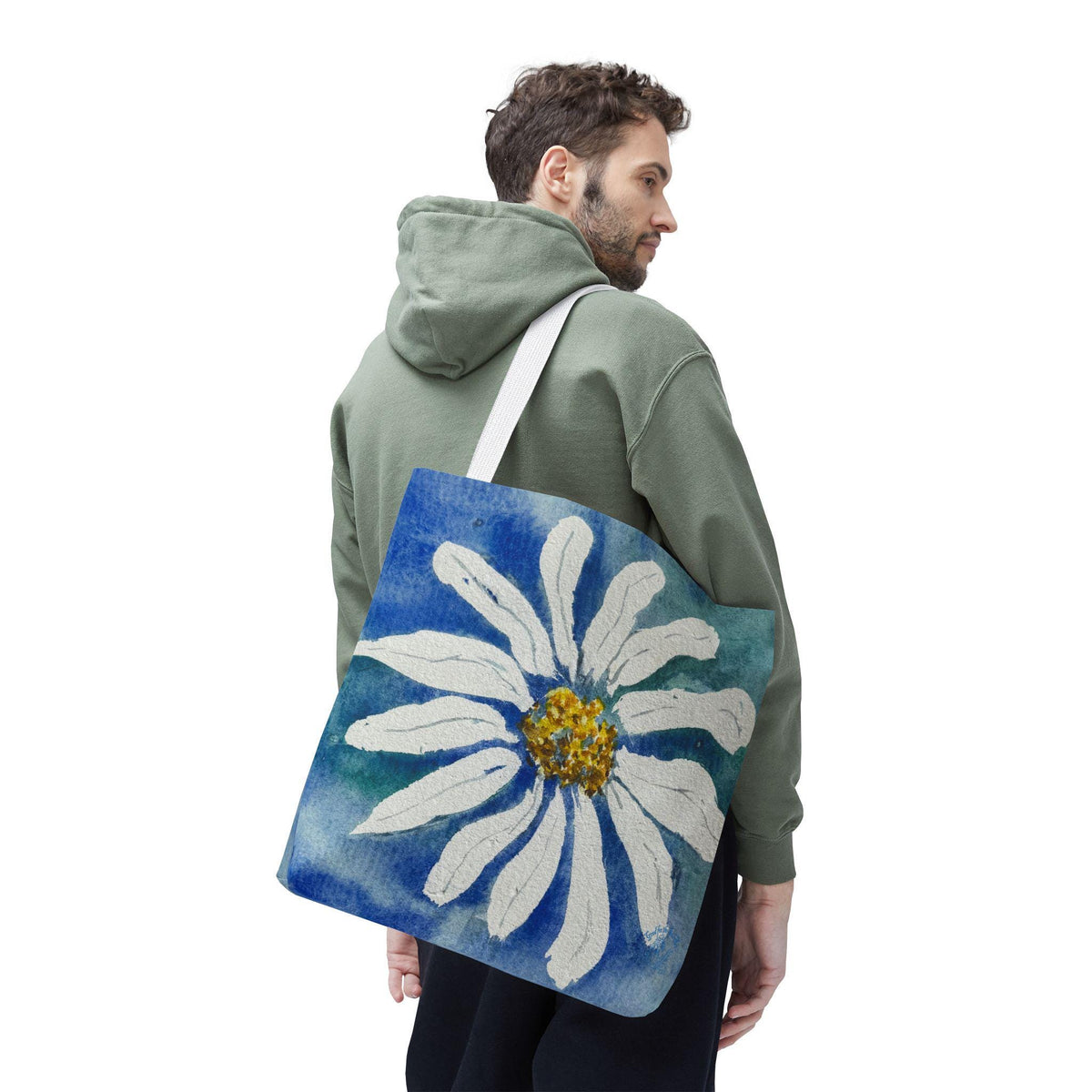 Watercolor daisy tote bag featuring a large hand-painted white daisy with a golden center on a deep blue and teal watercolor background, floral botanical shoulder bag designed from original artwork by Kathryn Young for Good For The Soul Art LLC.
