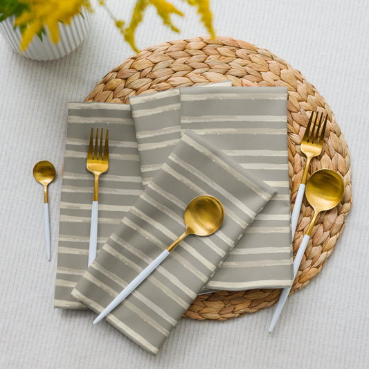 Set of four cloth napkins with hand-painted daisy vines in a watercolor stripe on soft stone gray