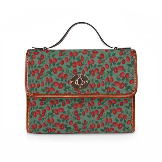 Waterproof canvas shoulder bag with vintage red cherry print on rich green and PU-leather handles