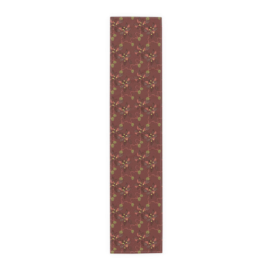 Christmas table runner with crimson poinsettias, flowing ribbons and golden bells, by Kathryn Young